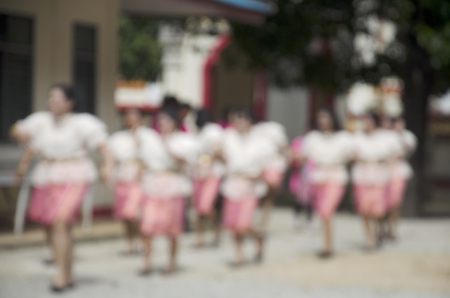 Blurred motion of thai people join in traditional processional candles for Asalha Puja And Buddhist Lent Day at Wat Khuha Phimuk or Na Thum temple in Yala southern provinces of Thailandの写真素材