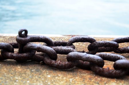 Rusty Ship Anchor Chains On Dry Coast In The Port at Kobe Harbour