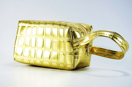 Gloden small woman bag with white backgroundの写真素材