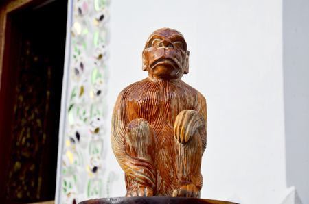 Traditional Thai style wood carving as animal wooden mokey one of 12 Zodiac in church of temple in Thailand and this art decorated in created with money donated by people, no restrict in copy or useの写真素材