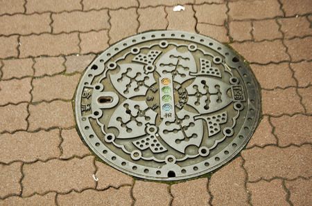 Art design symbol of Ameyayokocho market on Manhole cover at footpath beside road on October 21, 2016 in Tokyo, Japanのeditorial素材