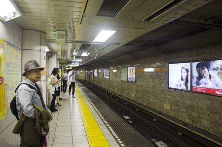Japanese people and foreigner traveler waiting subway train go to Tokyo city for work and visit at Ueno railway station of Kanto region on October 20, 2016 in Tokyo, Japanのeditorial素材