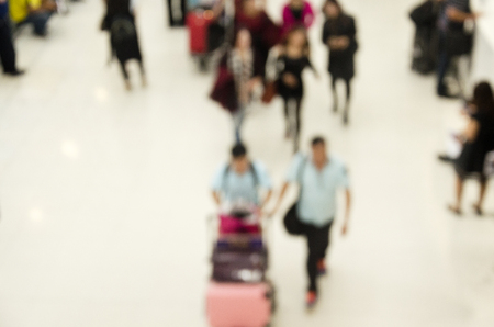 Blurred motion of thai people and foreigner traveller wait flight and walk inside with passengers arriving and departing at Suvarnabhumi international airport station in Bangkok, Thailandのeditorial素材