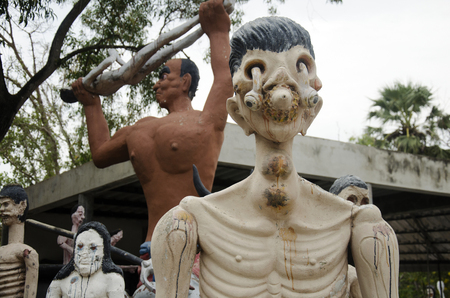 People pray and visit statues of ghost and zombie (Preta) in place of departed spirits or hell land at Wat Phai Rong Wua on January 7, 2017 in Suphan Buri, Thailandのeditorial素材