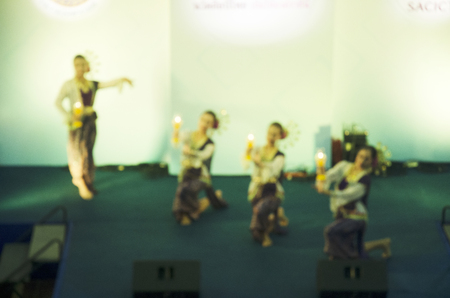 Blurred motion of actor and actress thai people dance dancing thai style for show people on state at...