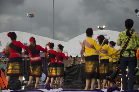 Thai women dancer dancing thai style for show people in traditional culture thai festival while raining in Tha Nam Non Market on July 27, 2016 in Nonthaburi, Thailandのeditorial素材