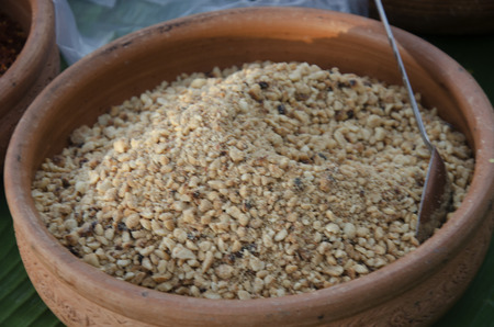 Crushed peanuts in earthenware for cooking thai food for sale at marketの写真素材