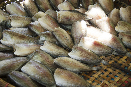Dried raw fish or Gourami fish preserves for sale at local shop in Wat Muang temple in Ang Thong,...