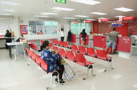 Thai people sending parcel post and employee service customer by fast and friendly at post office on January 25, 2017 in Bangkok, Thailandのeditorial素材