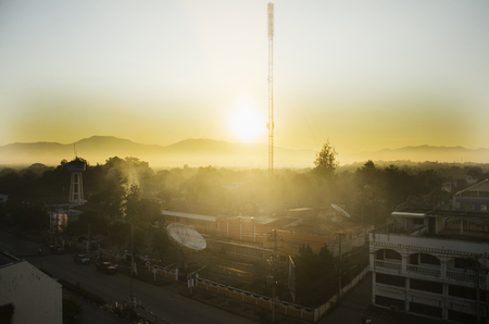 Cityscape with traffic road of at tower artesian aquifer and Broadcasting Services station Lampang city in morning time on December 27, 2016 in Lampang, Thailandのeditorial素材