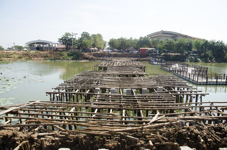 Asian thai workers and team working builder new building bridge at construction site of Bueng Boraphet public park on December 30, 2016 in Nakhon sawan, Thailandのeditorial素材