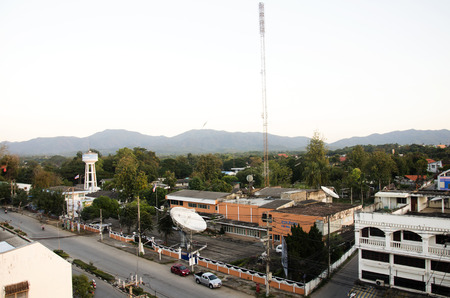 Landscape with motion of smoke and tower artesian aquifer of Provincial Waterworks Authority at Lampang city in morning time on December 28, 2016 in Lampang, Thailandのeditorial素材