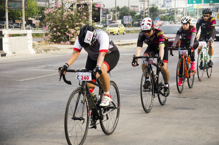 Asian thai people biking bicycle in race on street highway with traffic road at Bangbuathong city on February 26, 2017 in Nonthaburi, Thailandのeditorial素材