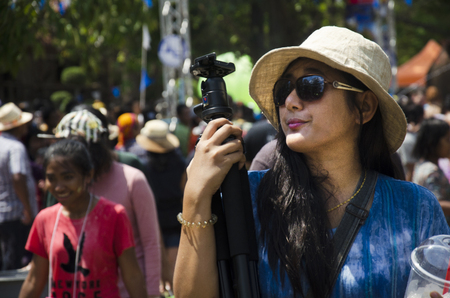 Traveler thai woman posing and travel join with  Songkran Festival is celebrated in a traditional thai New Year at Ayutthaya city on April 14, 2017 in Ayutthaya,Thailandのeditorial素材