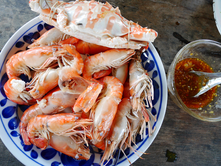 Steamed Flower crab or Blue crabs and shrimp or prawn with spicy seafood sauce in Thai styleの写真素材