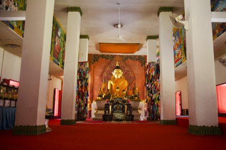Golden buddha statue in ubosot for people and travellers praying at Wat Phon Chai and travel Phi Ta Khon Museum on February 22, 2017 in Loei, Thailandのeditorial素材