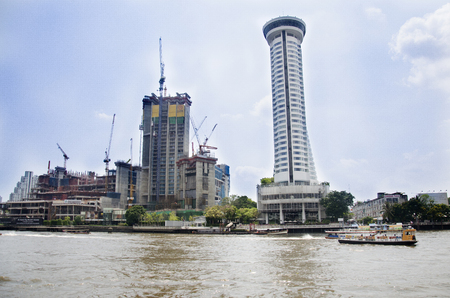 Cityscape and construction site with many boat in traffic water at chao phraya river on February 16, 2017 in Bangkok, Thailandのeditorial素材