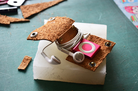 Handcrafted genuine leather pocket for keep or winder wrapped earphone cableの写真素材