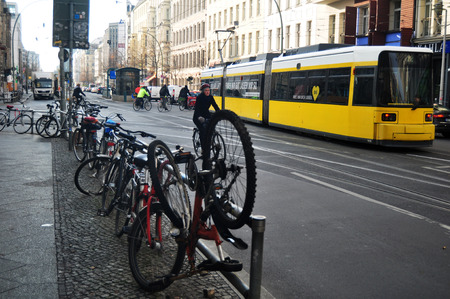 German people biking bicycle and lock bike at bicycle parking beside road for go to passenger tramway networks at Berlin city on November 9, 2016 in Berlin, Germanyのeditorial素材