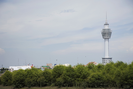 Samut Prakan Tower sits at river site of Chao phraya river at Amphoe Phra Samut Chedi for serve tourists visiting and sightseeing cityscape in Samut Prakan, Thailandの写真素材