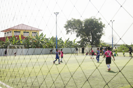 Asian thai children playing futsal in tournament at futsal pitch on January 21, 2017 in Bangkok, Thailandのeditorial素材
