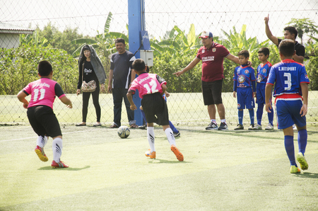 Asian thai children playing futsal in tournament at futsal pitch on January 21, 2017 in Bangkok, Thailandのeditorial素材