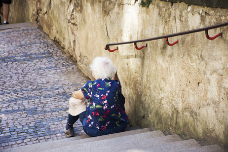 Czechia old women sitting lonely.の写真素材