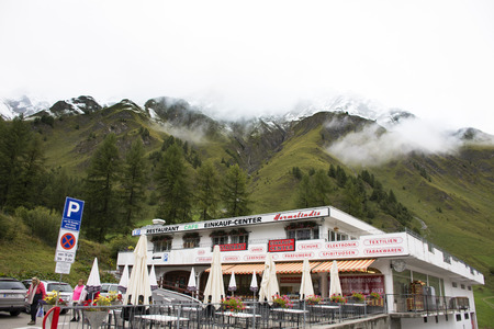 Swiss and travelers people travel rest and shopping duty free at shop in Samnaun village near Alps mountain at shop on September 2, 2017 in Graubunden, Switzerlandのeditorial素材