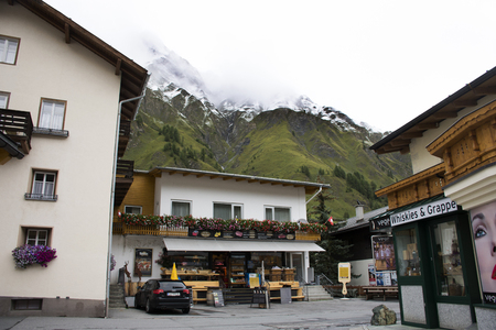 Swiss people and foreigner travelers travel rest and shopping duty free at shop in Samnaun village near Alps mountain on September 2, 2017 in Graubunden, Switzerlandのeditorial素材