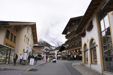 Swiss people and foreigner travelers travel rest and shopping duty free at shop in Samnaun village near Alps mountain on September 2, 2017 in Graubunden, Switzerlandのeditorial素材