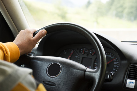 German old man driving car very fast on highway of Stuttgart go to Sandhausen district on September 3, 2017 in Stuttgart, Germany.のeditorial素材