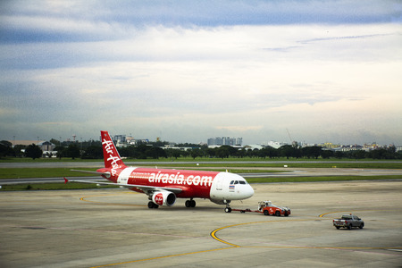 Aircraft prepare to take off from runway at Don Mueang international airport in dawn time on September 17, 2017 in Bangkok, Thailandのeditorial素材