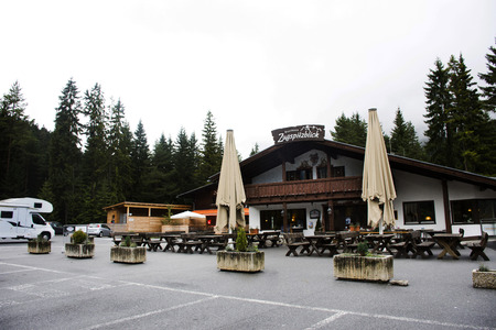 Austrian and travelers people stop car for dining at Rasthaus Zugspitzblick restaurant and visit looking viewpoint of Blindsee is a lake on mountain on September 1, 2017 in Biberwier, Austriaのeditorial素材