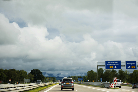 Travelers people driving car on the highway road go to Tirol city in Austria passed at Ulm city on September 2, 2017 in Stuttgart, Germanyのeditorial素材