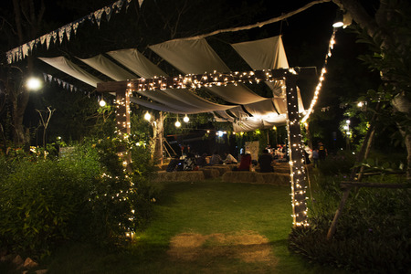Thai people and foreigner travellers walking travel and shopping at street market fair in night time on November 27, 2017 in Nakhon Ratchasima, Thailand.のeditorial素材