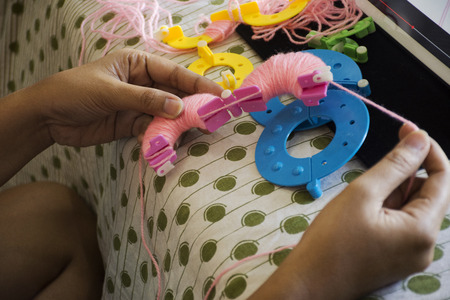 Thai women made and learning handmade decorations pompom or pompon is a decorative ball or tuft of...