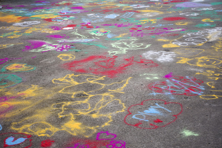 Thai children play and painting powder color on ground in Bang Mod festival at Thung Khru District in Bangkok, Thailandの写真素材