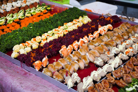 Japanese cuisine Sushi thai style many variety topping for sale at street food market in Bangkok, Thailandの写真素材