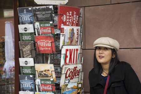 Asian thai woman posing with shelf book at gift shop in the forest at black forest or Schwarzwald at Baden-wurttemberg on September 8, 2017 in Stuttgart, Germanyのeditorial素材