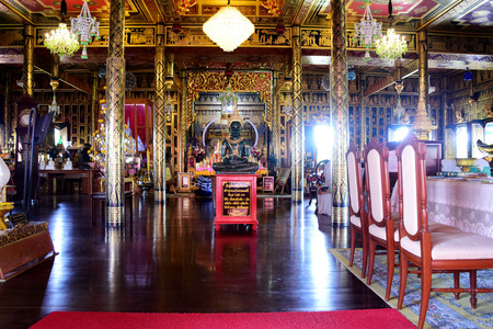 Thai people visit travel and respect praying with buddha inside ubosot of Wat Chulamanee Temple at Amphawa on September 26, 2017 in Samut Songkhram, Thailandのeditorial素材