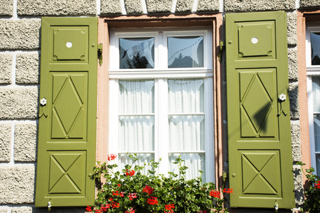 Classic retro vintage window on wall of house in Ladenburg town at Baden-wurttemberg, Germanyの写真素材