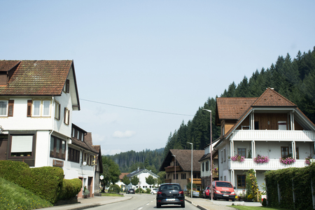 People driving car on the road passed Besenfeld village in Seewald town at Freudenstadt go to Black forest on August 27, 2017 in Baden-Wurttemberg, Germanyのeditorial素材