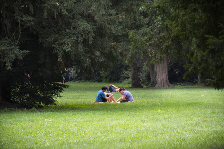 German people sit relax and picnic in garden of Speyer Cathedral at Speyer town on August 27, 2017 in Rhineland Palatinate, Germanyのeditorial素材