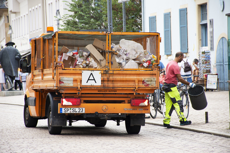 German people sweeper working clean and keep garbage and push garbage truck on the road at Speyer town on August 27, 2017 in Rhineland Palatinate, Germanyのeditorial素材