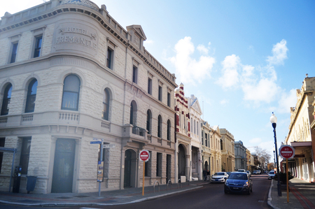 Australian people and foreigner travelers walking on pavement beside road with classic building and traffic road at Cliff street on May 28, 2016 in Perth, Australiaのeditorial素材