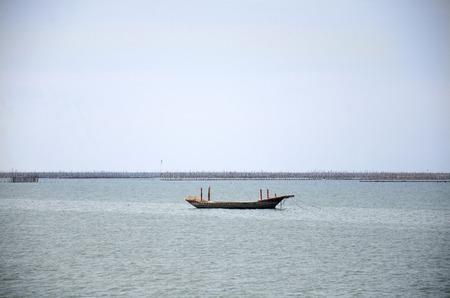 Fishing boat and ship floating in the sea for waiting fishing in night time at Ang Sila Fishing...