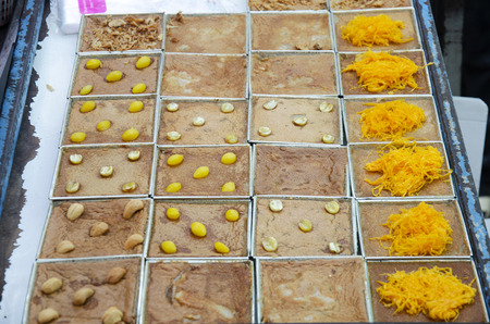 Sweet snack thai style Khanom Maw Kaeng or thai coconut custard squares for sale at local shop at...