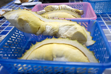 Thai people greengrocer peeling durian fruit for travelers people in fruits buffet festival at countryside between Chanthaburi to Rayong, Thailandの写真素材