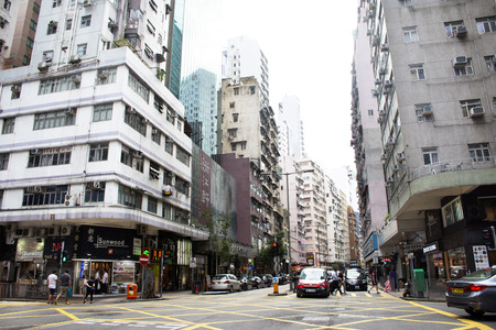 Traffic road with chinese people walking beside road and crossing road at Wan Chai Road between...