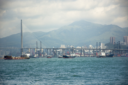 View landscape and cityscape of Hong Kong island with boat and ship in sea of Victoria Harbour at Kennedy Town on September 4, 2018 in Hong Kong, Chinaのeditorial素材